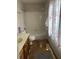 Modest bathroom features a combination tub and shower, vanity, and distinct decorative curtain at 4819 Coppedge Trl, Peachtree Corners, GA 30096