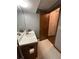Full bathroom with toilet, single sink vanity, and open door at 4819 Coppedge Trl, Peachtree Corners, GA 30096
