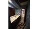 Bathroom features wallpaper, sink, wood cabinets and mosaic tile floor at 4819 Coppedge Trl, Peachtree Corners, GA 30096