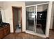 Bathroom features a toilet, sink, and shower with a bench at 4819 Coppedge Trl, Peachtree Corners, GA 30096