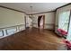 Bright dining room with hardwood floors, elegant moldings, and a view through to the entry way at 4819 Coppedge Trl, Peachtree Corners, GA 30096