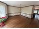 Elegant dining room featuring hardwood floors, chair rail molding, and large windows for abundant light at 4819 Coppedge Trl, Peachtree Corners, GA 30096