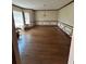 Spacious dining room with hardwood floors, decorative molding, and large windows offering natural light at 4819 Coppedge Trl, Peachtree Corners, GA 30096