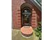 Detailed shot of the front door with brick archway at 4819 Coppedge Trl, Peachtree Corners, GA 30096