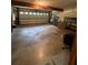Spacious garage with a multi-panel door, concrete floor, and ample space for parking and storage at 4819 Coppedge Trl, Peachtree Corners, GA 30096