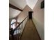 Hallway with a banister overlooking the front door at 4819 Coppedge Trl, Peachtree Corners, GA 30096