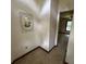 View of carpeted hallway leading to a bedroom, showcasing the home's layout and design at 4819 Coppedge Trl, Peachtree Corners, GA 30096