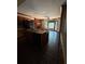 Functional kitchen featuring an island with a sink, a brick fireplace, and an eat-in breakfast nook at 4819 Coppedge Trl, Peachtree Corners, GA 30096