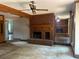 Cozy living room featuring a brick fireplace, carpet, and wood details, creating a warm and inviting space at 4819 Coppedge Trl, Peachtree Corners, GA 30096