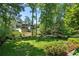 Sprawling backyard bordered by mature trees offers privacy and tranquility at 733 Greenview Ne Ave, Atlanta, GA 30305