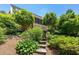 Multi-tiered backyard with stone steps and lush landscaping offers a serene outdoor escape at 733 Greenview Ne Ave, Atlanta, GA 30305