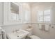 Classic white bathroom with wainscoting, stylish fixtures, and natural light at 733 Greenview Ne Ave, Atlanta, GA 30305