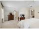 Spacious carpeted bedroom with a white ceiling fan and classic wood furniture at 733 Greenview Ne Ave, Atlanta, GA 30305