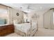 Bedroom with neutral color scheme, ceiling fan, and a white four-poster bed at 733 Greenview Ne Ave, Atlanta, GA 30305