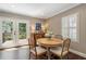 Bright breakfast nook with hardwood floors and light-filled windows leading to a deck at 733 Greenview Ne Ave, Atlanta, GA 30305