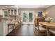 Open breakfast nook featuring a breakfast bar, wood floors, and deck access at 733 Greenview Ne Ave, Atlanta, GA 30305