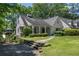 Traditional-style home with a covered front porch and manicured landscaping at 733 Greenview Ne Ave, Atlanta, GA 30305
