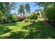 Charming home boasts a well-manicured lawn and lush landscaping, enhancing its curb appeal at 733 Greenview Ne Ave, Atlanta, GA 30305