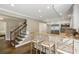 Open kitchen with counter seating, stainless appliances, and easy access to the staircase at 733 Greenview Ne Ave, Atlanta, GA 30305
