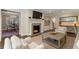 Elegant living room with fireplace, hardwood floors, and seamless access to the dining room at 733 Greenview Ne Ave, Atlanta, GA 30305