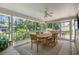 Inviting screened porch featuring a large dining table and outdoor lounge space at 733 Greenview Ne Ave, Atlanta, GA 30305