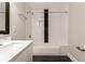 Modern bathroom featuring subway tile, black accent tile, and sleek fixtures and finishes at 870 Gaston Sw St, Atlanta, GA 30310