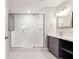 Modern bathroom featuring a frameless glass shower and gray vanity at 870 Gaston Sw St, Atlanta, GA 30310
