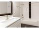 Bathroom featuring white subway tile, black accent tile, and modern fixtures and finishes at 870 Gaston Sw St, Atlanta, GA 30310