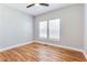 Cozy bedroom with hardwood floors, windows, and a ceiling fan at 870 Gaston Sw St, Atlanta, GA 30310