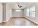 Spacious bedroom with hardwood floors, two windows, and neutral paint at 870 Gaston Sw St, Atlanta, GA 30310