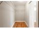 Walk-in closet featuring wood flooring and wire shelving for optimal storage and organization at 870 Gaston Sw St, Atlanta, GA 30310