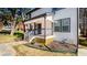 Charming two-story home with a covered front porch, landscaped yard, and a stone walkway at 870 Gaston Sw St, Atlanta, GA 30310