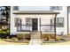 Two-story home with a covered front porch and well-maintained landscaping at 870 Gaston Sw St, Atlanta, GA 30310