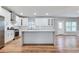 Bright kitchen featuring white cabinets, stainless steel appliances, and a center island at 870 Gaston Sw St, Atlanta, GA 30310