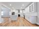 Open kitchen with white cabinets, stainless steel appliances, and quartz countertops at 870 Gaston Sw St, Atlanta, GA 30310
