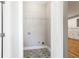 Charming laundry room features patterned tile floors and a wire rack for storage at 870 Gaston Sw St, Atlanta, GA 30310