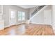 Bright living room with hardwood floors, stairs, and modern doors at 870 Gaston Sw St, Atlanta, GA 30310