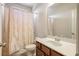 Well-lit bathroom with a vanity, toilet, and shower with curtain at 218 Ballymore Lane Ln, Acworth, GA 30102