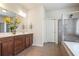 Bathroom features double vanity with granite countertop, tiled floors, and glass shower enclosure at 218 Ballymore Lane Ln, Acworth, GA 30102