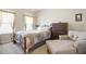 Comfortable bedroom featuring a bed with a colorful quilt, chair and dresser at 218 Ballymore Lane Ln, Acworth, GA 30102