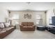 Upstairs bonus room with a brown leather sofa, large windows, and neutral carpet at 218 Ballymore Lane Ln, Acworth, GA 30102