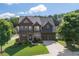 Beautiful two-story home featuring a landscaped yard and a welcoming front porch at 218 Ballymore Lane Ln, Acworth, GA 30102