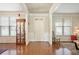 Bright foyer featuring hardwood floors, white trim, and a glimpse into the adjoining rooms at 218 Ballymore Lane Ln, Acworth, GA 30102