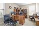 Bright home office with large desk and bookshelves with natural light at 218 Ballymore Lane Ln, Acworth, GA 30102
