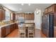 A kitchen with wooden cabinets, granite countertops, stainless steel appliances, and a kitchen island at 218 Ballymore Lane Ln, Acworth, GA 30102