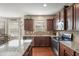 A spacious kitchen area featuring an island, stainless steel appliances, and hardwood floors at 218 Ballymore Lane Ln, Acworth, GA 30102