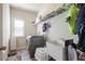 Functional laundry room with washer, dryer, sink, and storage shelves at 218 Ballymore Lane Ln, Acworth, GA 30102