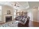 Inviting living room with a fireplace, coffered ceilings, and a comfortable leather sofa at 218 Ballymore Lane Ln, Acworth, GA 30102