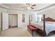 Spacious main bedroom features tray ceiling, four poster bed, sitting area, and ensuite bathroom at 218 Ballymore Lane Ln, Acworth, GA 30102