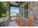 Inviting front porch with rocking chairs and stone accents at 218 Ballymore Lane Ln, Acworth, GA 30102